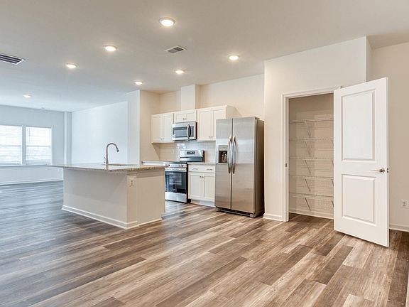 Kitchen and living area in the Hemlock floor plan - 3 bed / 2.5 bath.