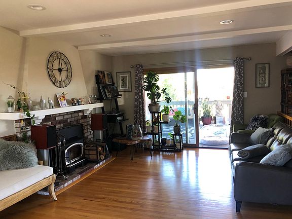 Indoor/outdoor living with wood-burning fireplace insert