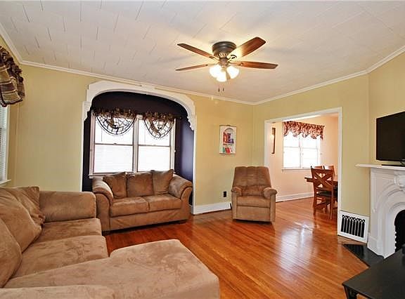 Note the turn of the century details and moldings, though this home has the comfort of central air conditioning.