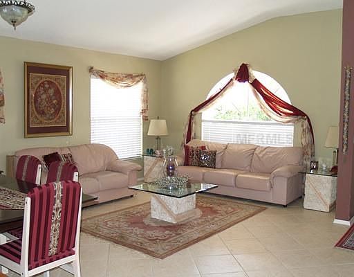 FORMAL LIVING ROOM WITH CERAMIC 18 IN TILE SET ON THE DIAGONAL! SOARING CEILIN
