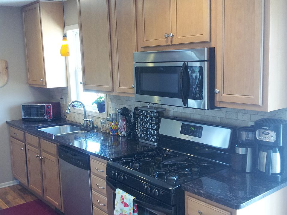 Stainless steel appliances with marble counter tops.