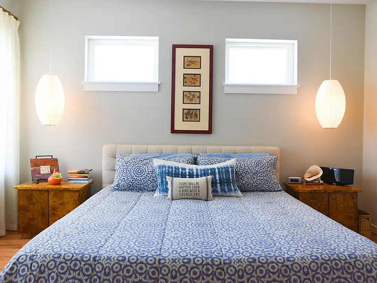 Primary Bedroom with custom lights and draperies.