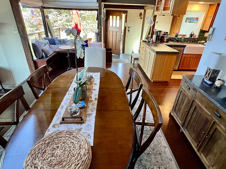 Dining area looking back towards front entry and kitchen.