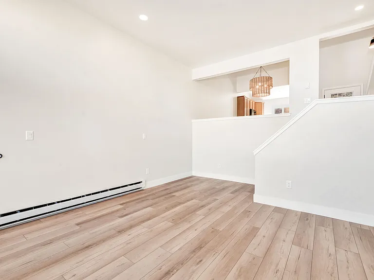 Living room with gas fireplace and walk out to back deck.