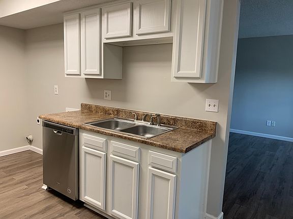 Kitchen with dishwasher and space for washer and dryer