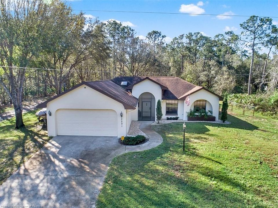Welcome to 2301 Preston Ave, Sebring, Fl. This pool home is on a private .80 (+/-) of an Acre, backyard is fenced and home featu