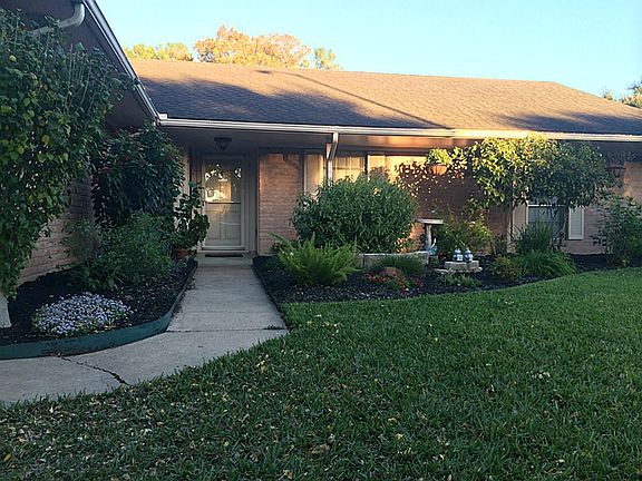 The lovely landscaping has been well manicured.