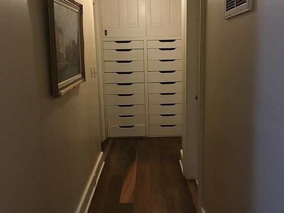 Hall leading to built in drawers and cabinet