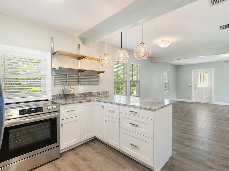 A full suite of stainless steel appliances offers a polished look and modern convenience, making meal prep effortless and cleanup a breeze.