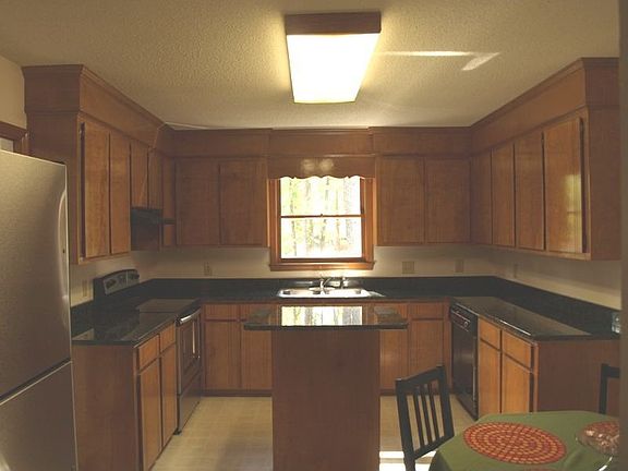 large eat-in kitchen with granite counter tops and stainless steel appliances