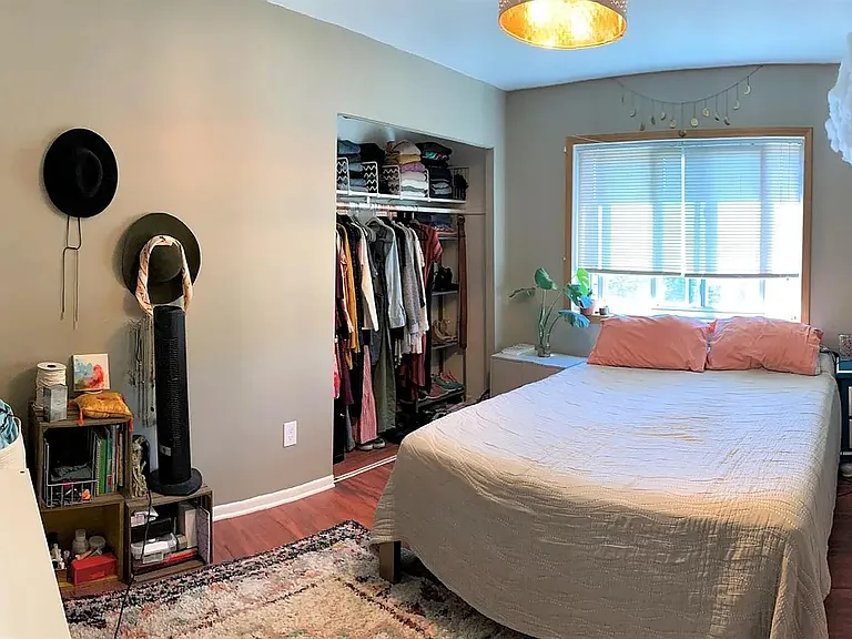 bedroom that features a large closet and ample storage