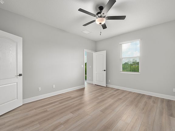 The master bedroom is spacious with a large window