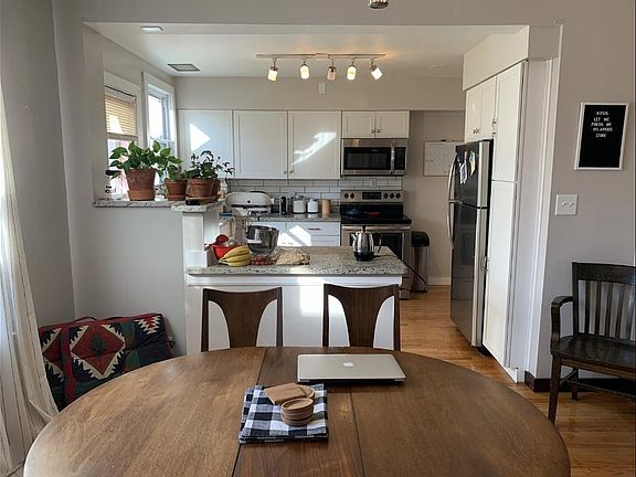 Open concept floor plan. Dining room opens to kitchen and living room