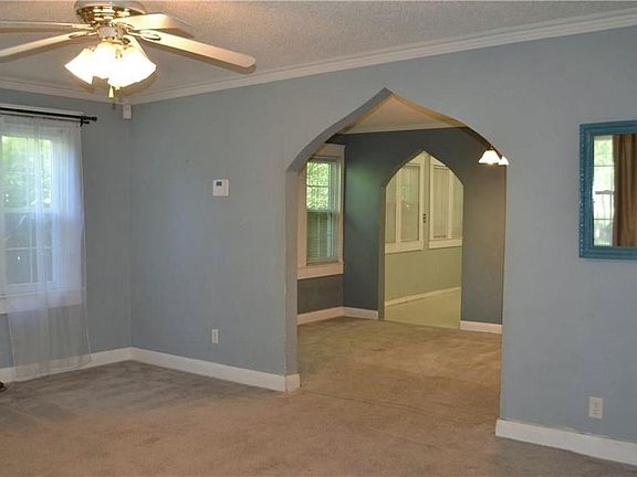 Pointed-arch entryways into the dining room and kitchen.