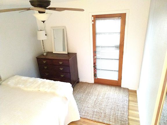 bedroom 1 opens to the backyard patio