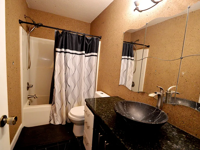 Upper bathroom. Granite countertop.