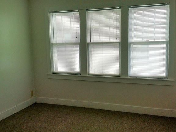 Bedroom has lots of light.