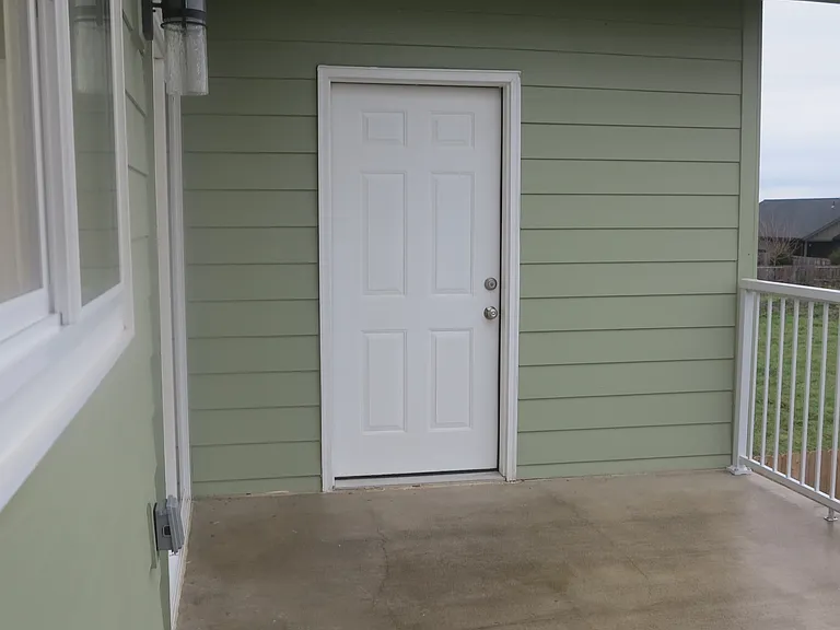Patio and the door into the storage room and laundry.