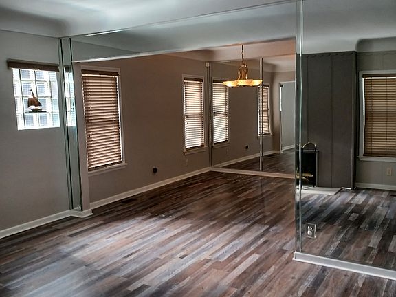 Entry into cozy living room with fireplace