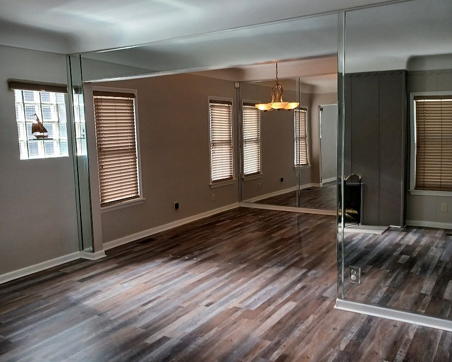 Entry into cozy living room with fireplace