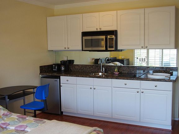 Microwave, hot plates, coffee maker, dishes etc provided.