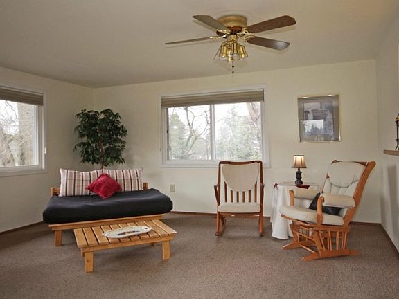 Family room just off the kitchen. This picture is only half the room and half the windows in this great room.