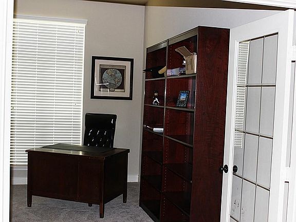 French doors lead to a study.