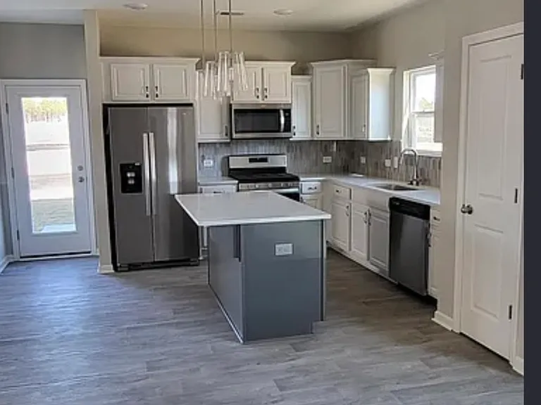 Kitchen and island, stainless steel appliances