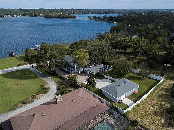 Aerial of the property...two car garage and workshop building near the back of the property...single car garage with storage roo