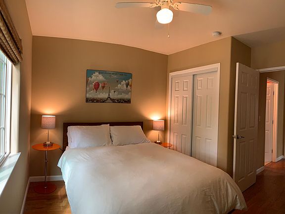 Bedrooms include luxury beds and bedding, closet and dresser.