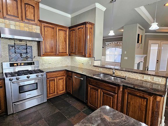 Chef's kitchen with 5 burner gas stove, pot filler, warming drawer, convection/microwave oven