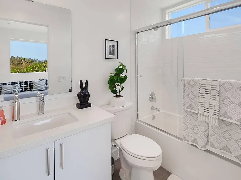 Full bathroom adjacent to third bedroom.