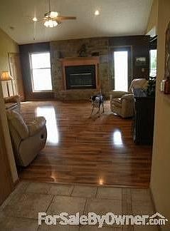 Family Room from Front Door : Family room has gas fire place and fan.
