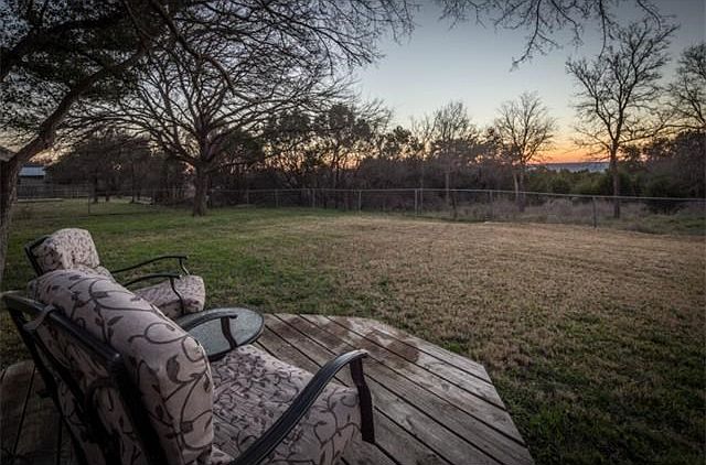 Have a seat and enjoy the sunset over the hill country views