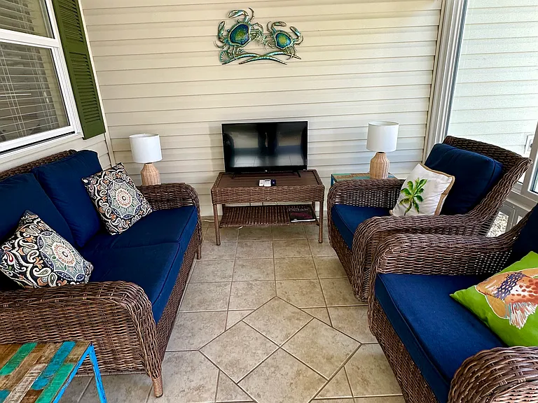 Enclosed Patio. Air Conditioned. 
It's a comfortable sitting room, with television.