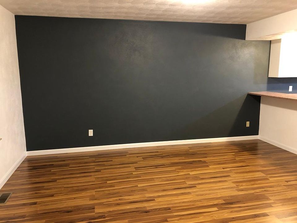 Living room. New floor with new painted trim.