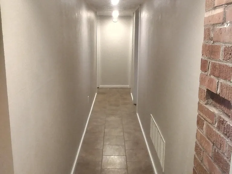 Hallway heading to bedrooms and office