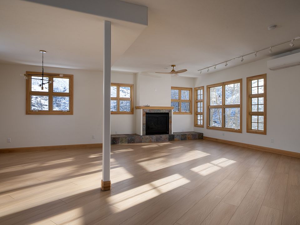 Spacious, light-filled great room with fireplace