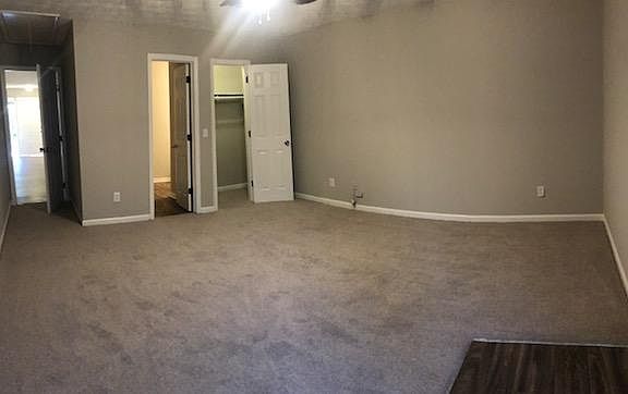 Large bedroom with walk in closet, ensuite bathroom and new carpet.