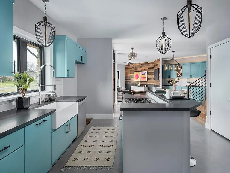 Farmer sink, Gas cooktop, Breakfast bar/ island and soft close cabinets.