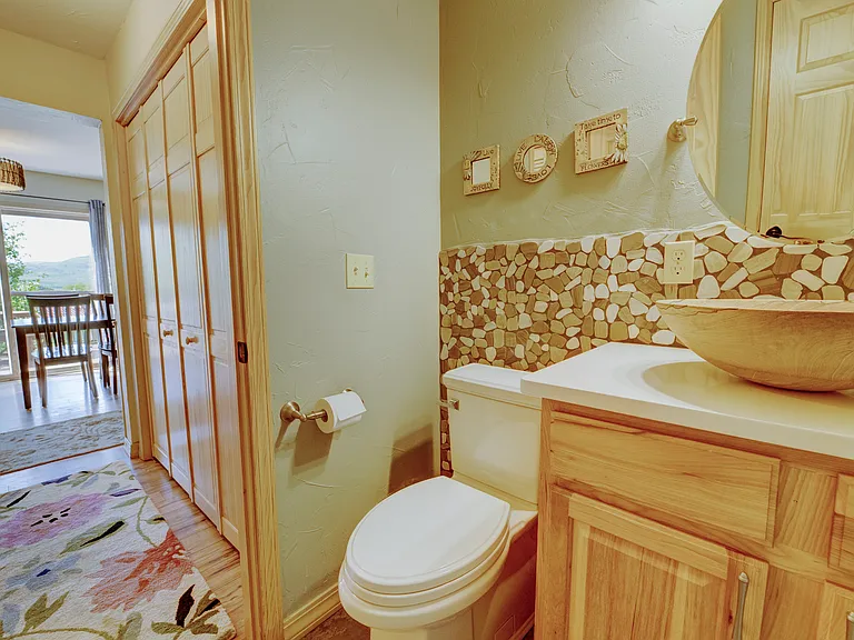 Half bath off the kitchen, pantry and laundry room.