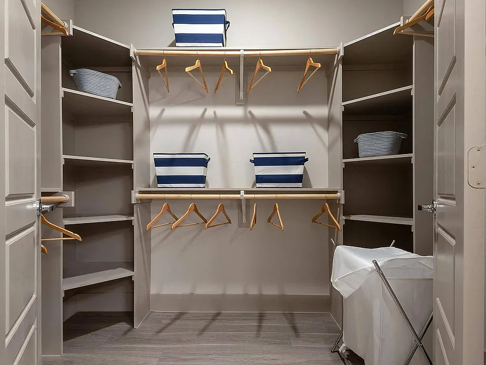 Oversized Walk-In Closet with Custom Built-In Shelving and Hanging Rods