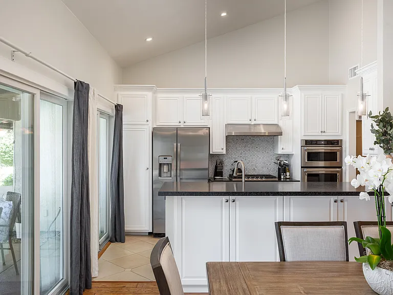 High-end crystal pendant lights over the kitchen counter.