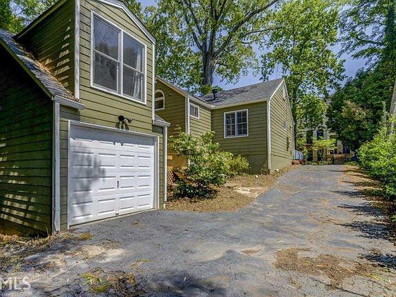 Detached one car garage and long drive offer plenty of off-street parking and security.