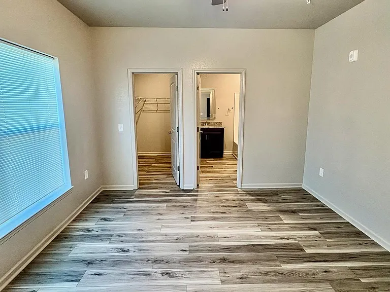 Bright and comfortable bedroom in a roomy 2-bedroom, 2-bath apartment.