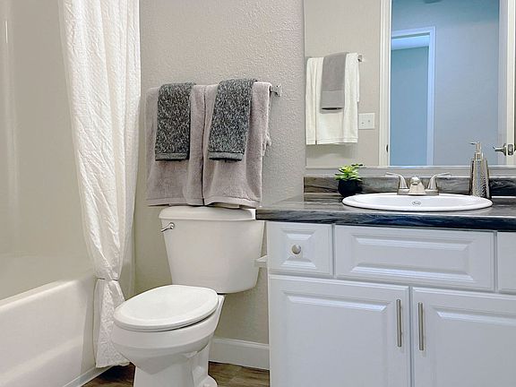 Clean, functional bathrooms feature a full bathtub for comfortable bathing, professionally operated by Highlands Vista Group.