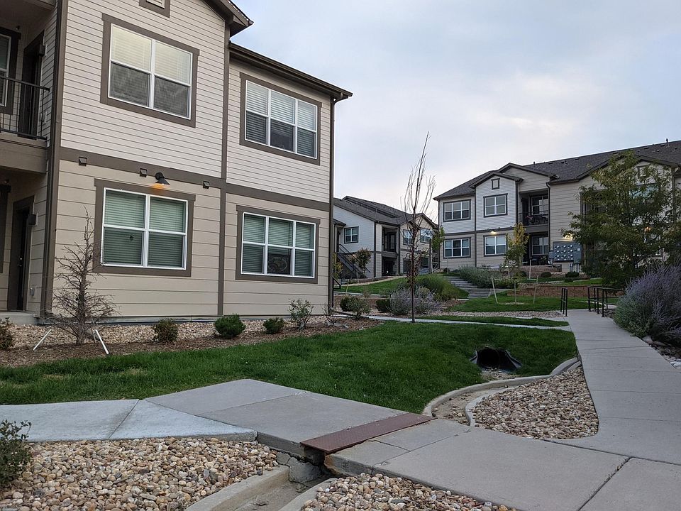 Landscaping outside the property. The 2 windows on the left 1st floor are the living room and dinning room.