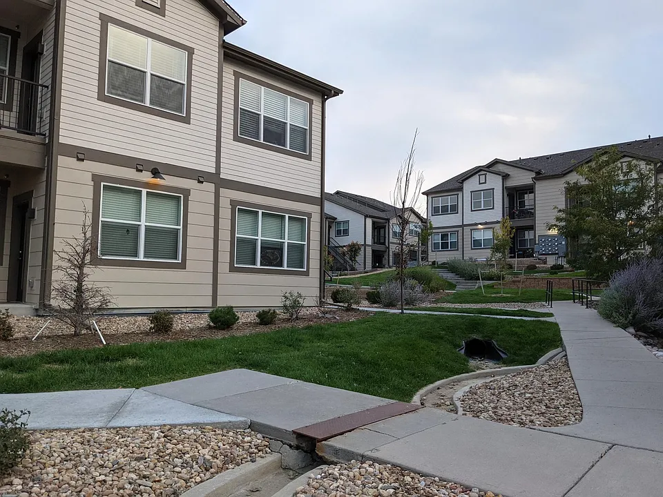 Landscaping outside the property. The 2 windows on the left 1st floor are the living room and dinning room.