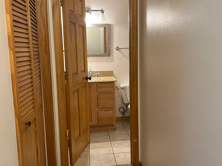 Hallway with closet to 2nd Bathroom