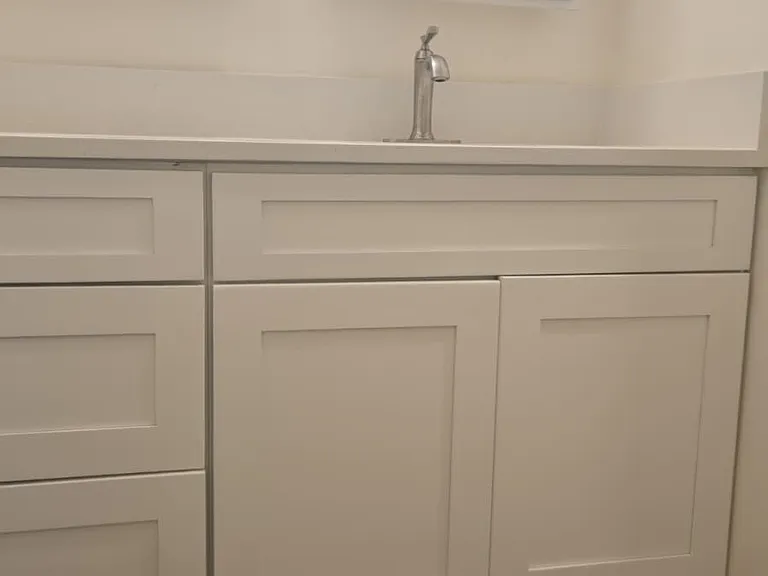 New vanity, faucet and cabinet with stone countertops